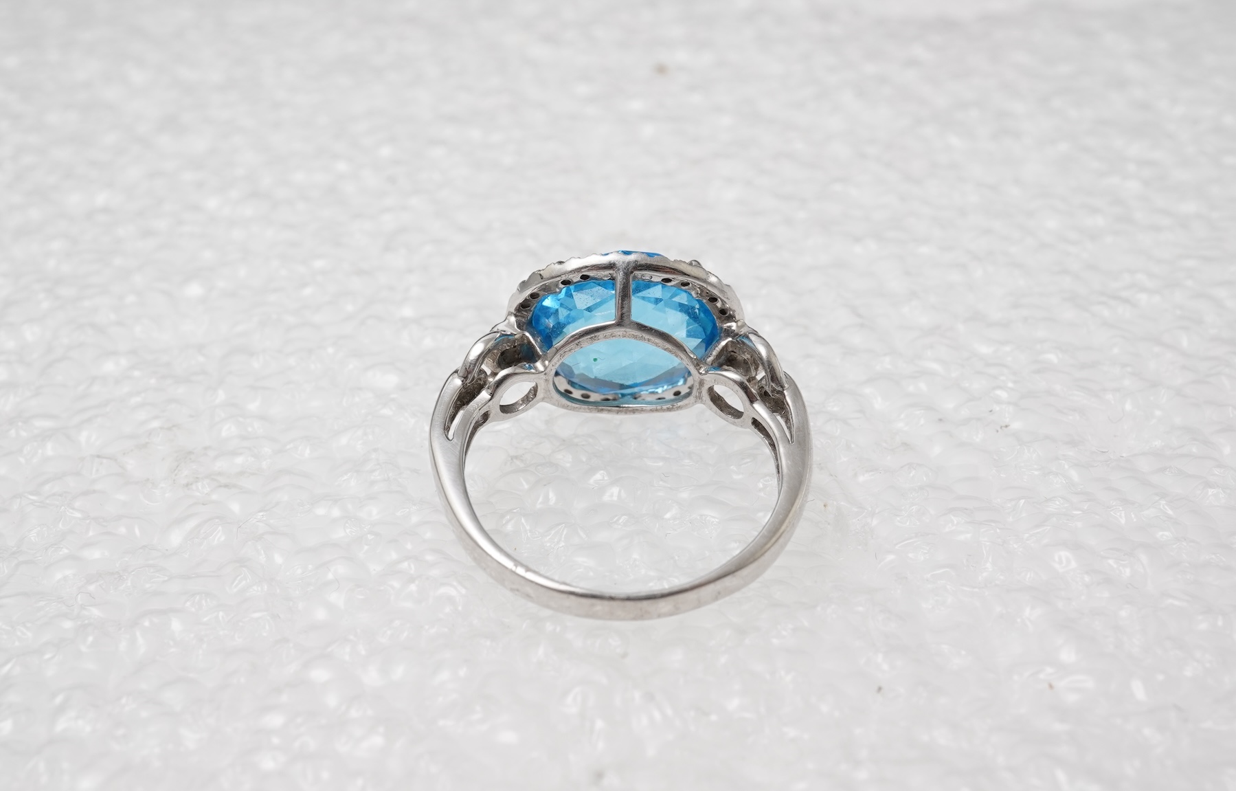 A blue topaz and diamond ring